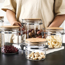 Load image into Gallery viewer, Glass Storage Jar With Clip Seal Wooden Lid ,4PC Set of Airtight - EK CHIC HOME